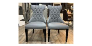 Pair Of Grey Leather Quilted Dining Chairs With Black Lacquer Legs And Details