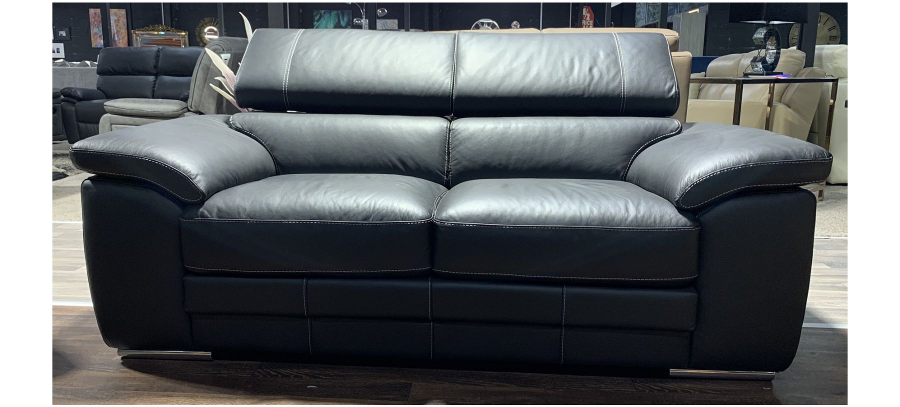 Black leather couch sales with white stitching